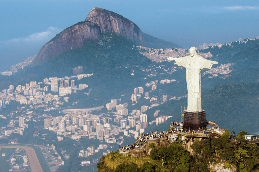 Aerial view of Christ the Redeemer with Guanabara Bay in the background, the final point of the hike to Corcovado through Parque Lage, in Rio de Janeiro.